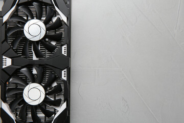 Computer graphics card on gray textured background, top view. Space for text