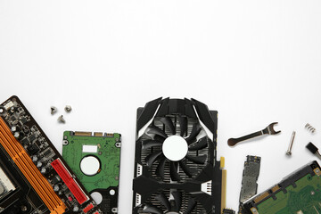 Graphics card and other computer hardware on white background, flat lay. Space for text