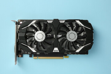 Computer graphics card on light blue background, top view