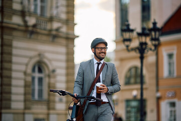 Happy entrepreneur with takeaway coffee going to work by bike.