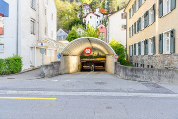 Entrance of an underground parking garage in a city centre at sunset in spring
