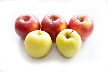 red and yellow apples on a white background