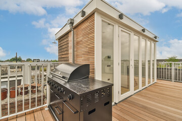 Modern rooftop terrace with outdoor kitchen grill