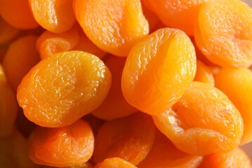 Dried fruits. Dried apricots. Dried apricots in close-up on a white plate.