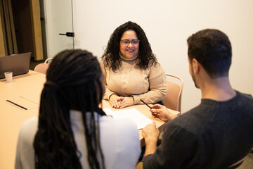 Diverse friends team collaborating in a modern coworking space