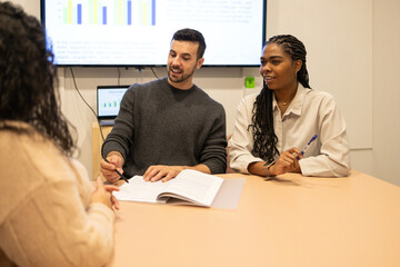 Diverse Team Working Together In Coworking Space