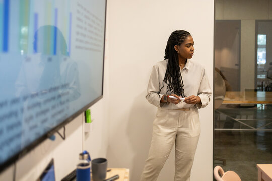 Professional woman presenting in modern coworking space