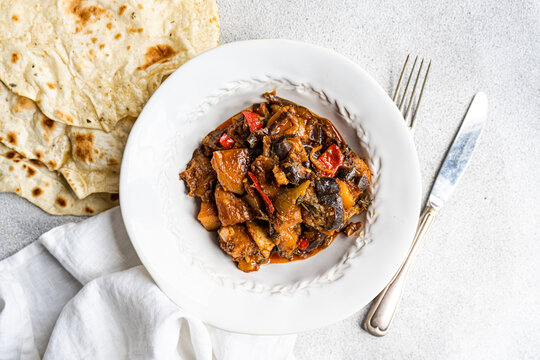 Hearty vegetable stew with homemade flatbread