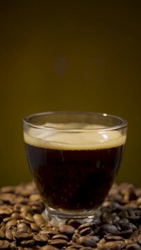 Elegance in Motion: Coffee Cup Over Roasted Beans in Slow Motion