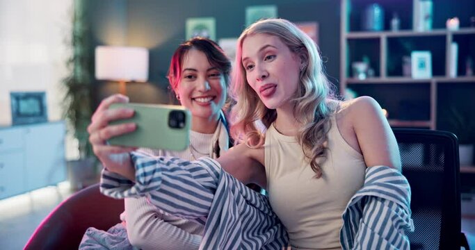 Happy woman, friends and influencer with selfie for memory, silly moment or photography at home. Female person with goofy face for fun picture, capture or vlogging together in living room at house