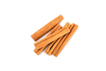 Cinnamon sticks isolated on white background. Cinnamon roll. Spicy spice for baking, desserts and drinks. Fragrant ground cinnamon.