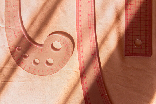 Essential tools for tailoring on a fabric background