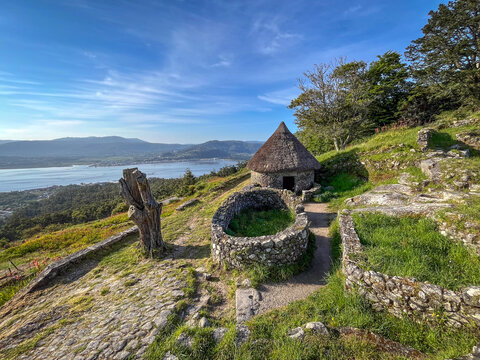 Ruins of ancient celtic settlement stone dwellings in mount of Santa Tecla archaeological site, Pontevedra, Spain