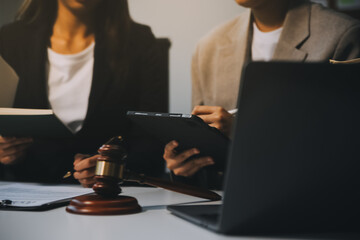 Lawyer, legal advisor, businessman brainstorming information on agreement details Business contracts in legal processing books for accuracy in contract documents. joint financial investment.