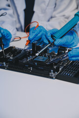 Close up of Technician measuring voltage electronic circuit board television, Service after sale fix electric equipment within insurance.