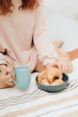 Young woman have breakfast in the bedroom