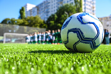 children's football match on an artificial field
