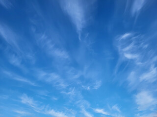 Beautiful blue sky and feathery white clouds nice bright day