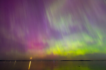 Night time skies light up in vibrant colors thanks to the Northern Lights over Washington state