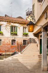 View of Venice historical center with characteristic bridge and canal in Santa Croce (Saint Cross)...