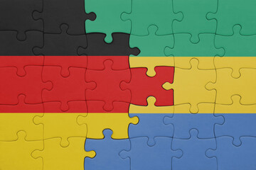 puzzle with the colourful national flag of gabon and flag of germany.
