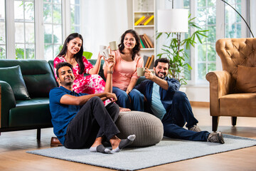 Indian asian young couple having coffee together at home