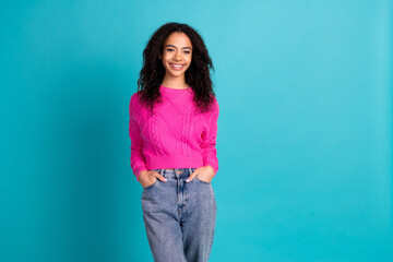 Photo of lovely young girl posing empty space wear pink pullover isolated on teal color background