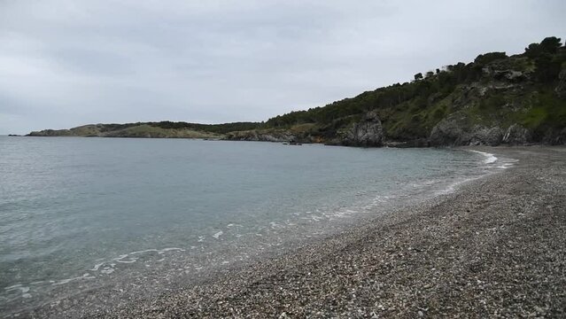 slow motion Calm sea on Garbet Colera beach Girona Spain Costa Brava on the Mediterranean coast