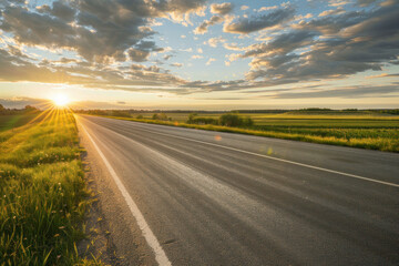 Empty Rural Road at Sunset with Fields and Cloudy Sky