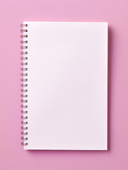 Blank spiral bound notebook with empty page on pink background 