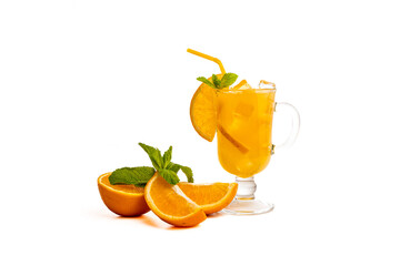 Orange cocktail in a glass with ice, a refreshing summer drink. Cold and orange punch with a slice of orange and mint on a white hairdryer. Copy space