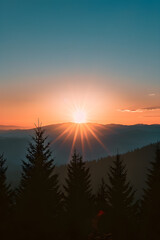 Serene Sunrise over Mountain Landscape with Pine Trees Silhouetted Against a Radiant Backdrop