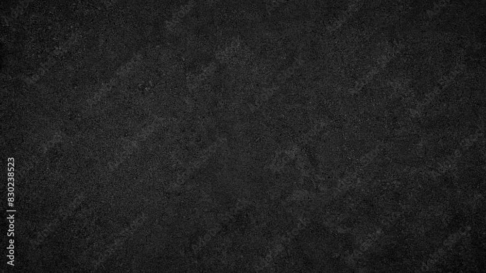 Fototapete A black background with no visible objects. The background is dark and has a rough texture. It is a simple and minimalistic design