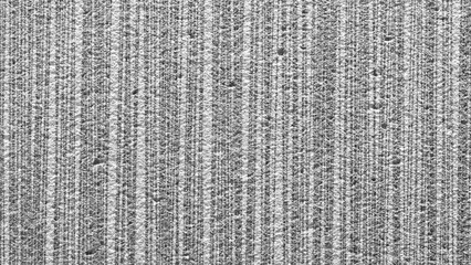 A grey and black background with a few white dots. The background is blurry and the dots are scattered all over it