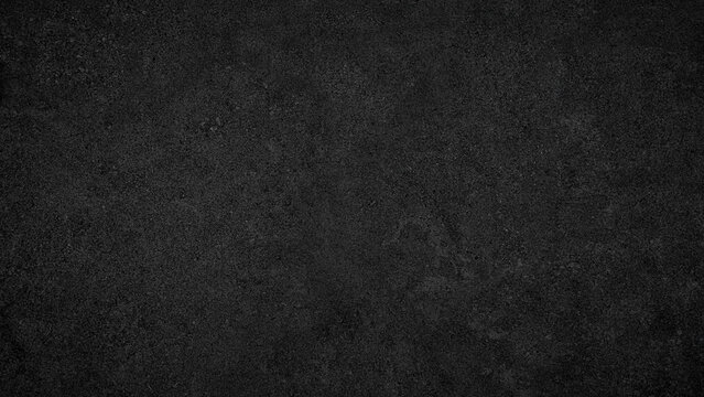 A black background with no visible objects. The background is dark and has a rough texture. It is a simple and minimalistic design