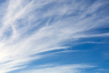 Blue sky with pattern of light soft clouds. Calm texture. Nature abstract background. Fresh air,...