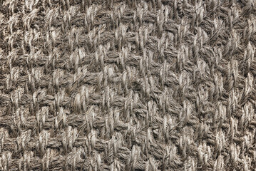 The texture of the vintage gray jute mat, background.