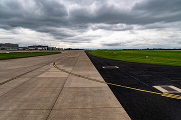 Plane Landing at Manchester International Airport on a Busy Spring Day