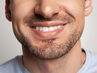 Obraz premium portrait of a mature man smiling, smile with perfect teeth, closeup on lips of a man, dental care, dentist advertising