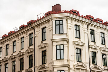 Corner windows of an old apartment building.