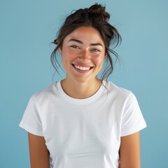 Fototapeta premium Excited woman in a white t-shirt with happy face on blue background. Happy grimace