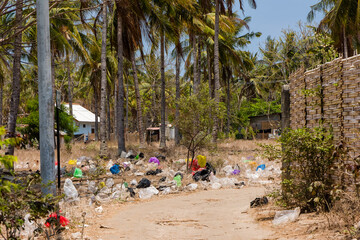 Huge amounts of plastic and discarded garbage in a back street of Gili Trawangan, Indonesia