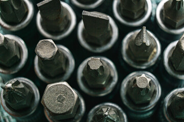 Close Up of a Bunch of screwdriver bits technical background