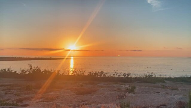 Beautiful golden sunrise in Qawra, Malta. Mediterranean sea. High quality 4k footage