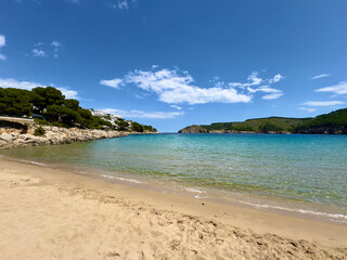 Cala Montgó with white sandy beach Platja de Montgó and beautiful turquoise water of the...
