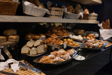 lots of baking bread and rolls for food in the store