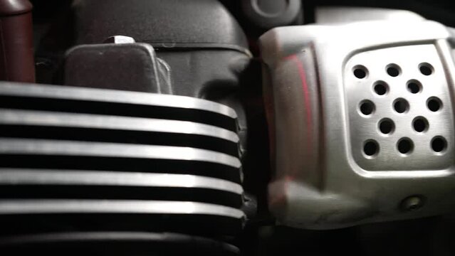 Camera Slides Along Carburetor And Engine Of Vintage Classic Naked Motorcycle