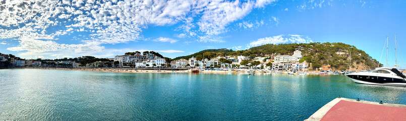 panoramic view of the beautiful bay with small marina for yachts in the village Llafranc, Camí de Ronda, Costa Brava, Girona, Catalonia, Spain