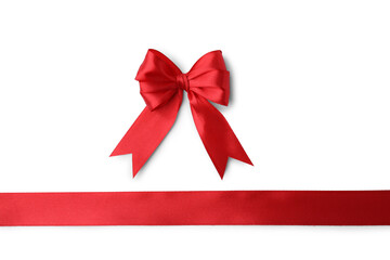 Red satin ribbon with bow isolated on white, top view