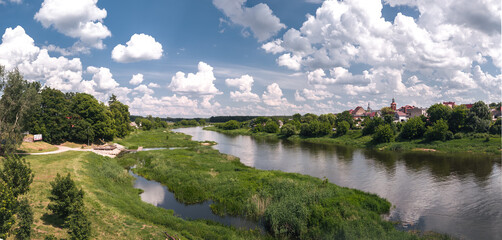 Wide panorama: cityscape of Obrzycko, Wielkopolska, Poland. Panoramic summer view of the old town. 